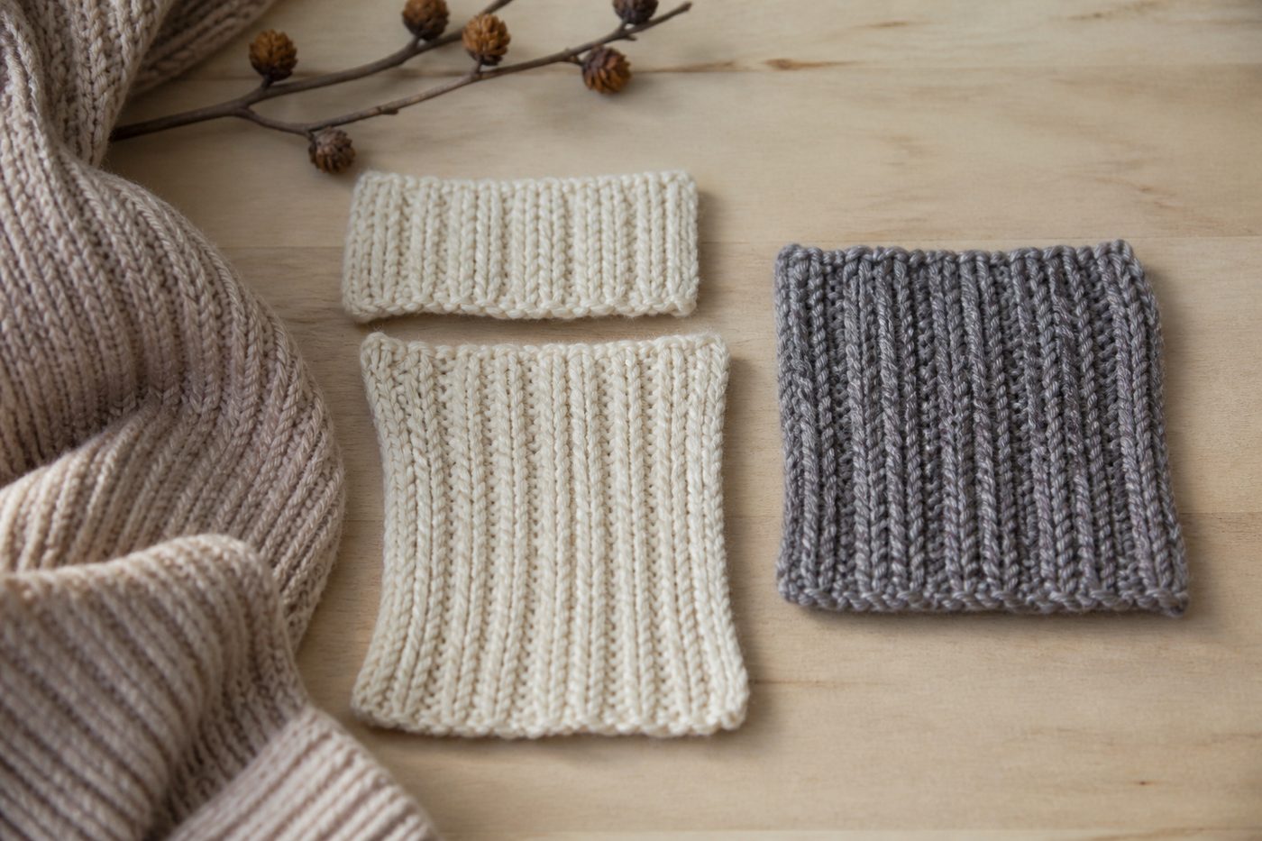 A one by one rib swatch shown relaxed and then stretched, next to a two by two rib swatch.